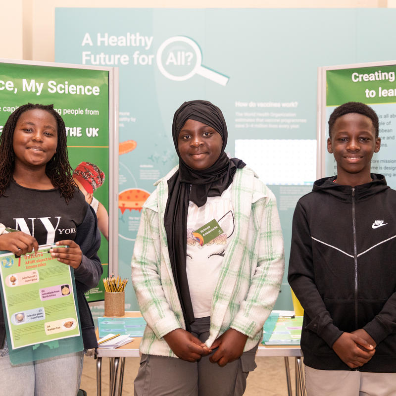 Young people welcoming visitors to the Museum
